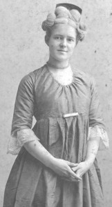 Nina Louise Winn (1877-1958) was the daughter of George Prentiss Winn (1846-1907) and his wife Melissa Sarah Bacon Winn (1853-1886). In 1901, Nina was living with her widowed father and her brother George Albert Winn (1873-1942) at 146 Mystic Street, Arlington, MA. This 1908 photo is of Nina dressed in Colonial dress, participating in an Arlington Historical Society event.